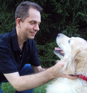 Veterinarian Dr Zeltzman looks fondly on at his labrador retriever.