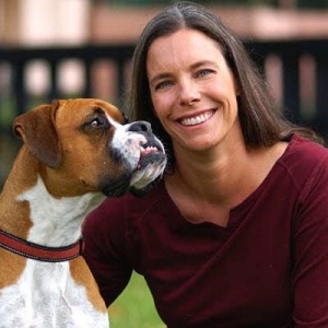 Veterinarian Dr. Coates poses with her boxer.